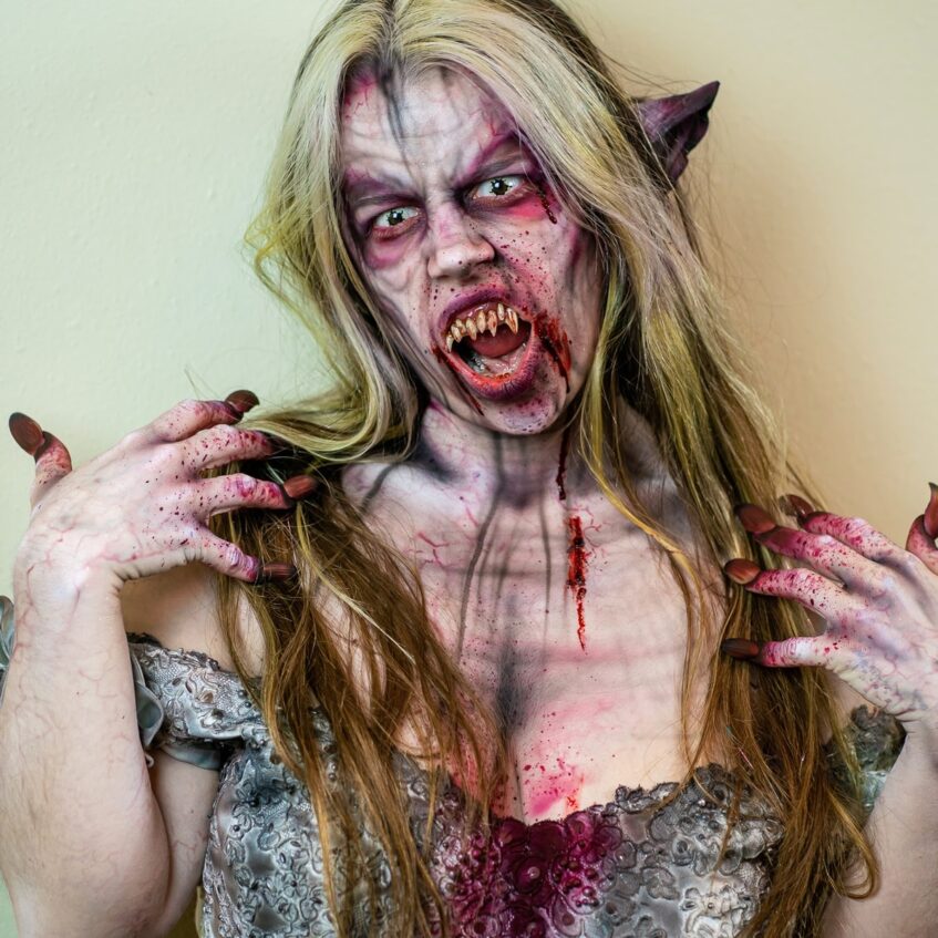 a creepy woman with a realistic zombie face paint