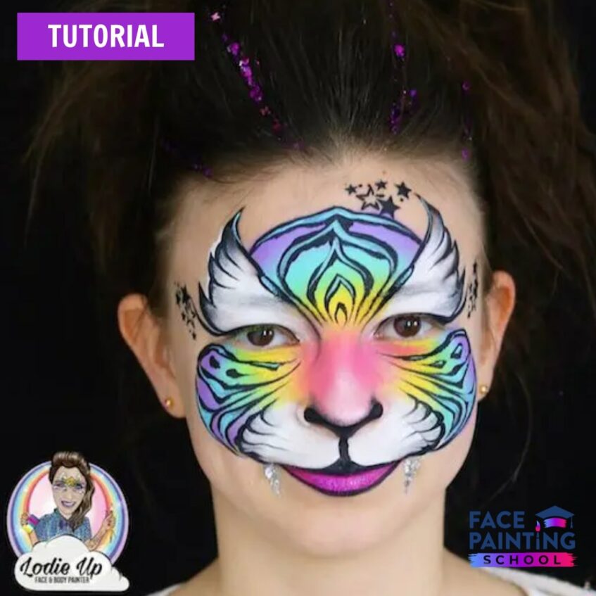 a young girl with a very colorful purple, green, and yellow tiger face painting on her.