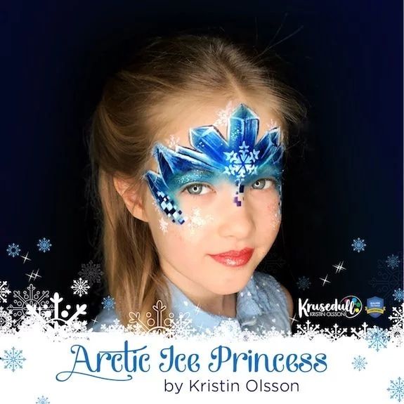 a girl with a compleated artic ice princess face paint design