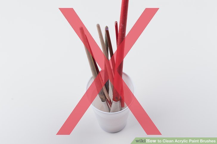 brushes in a cup placed head down with a huge X over them