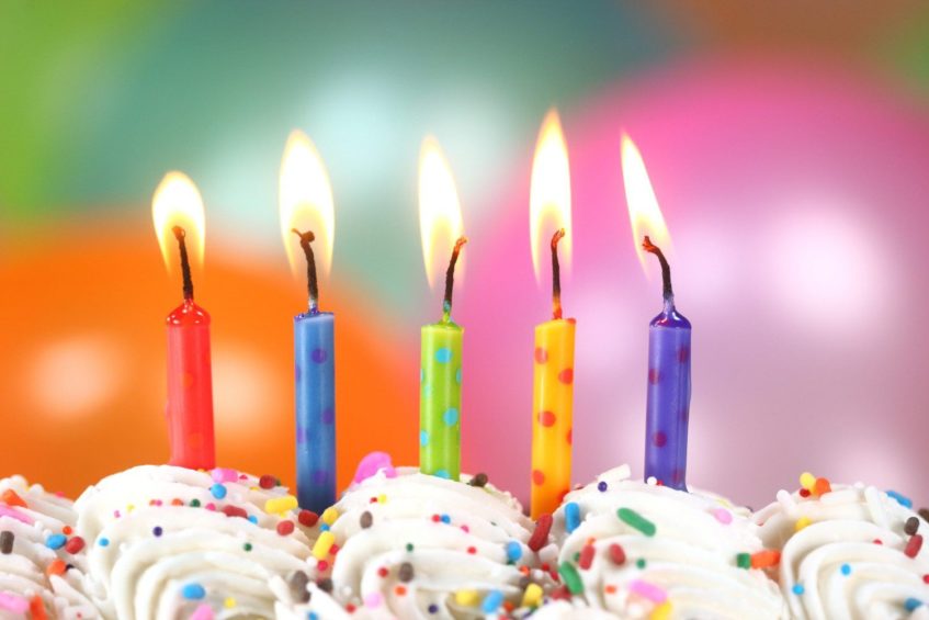 an image of 5 lighted birthday candles