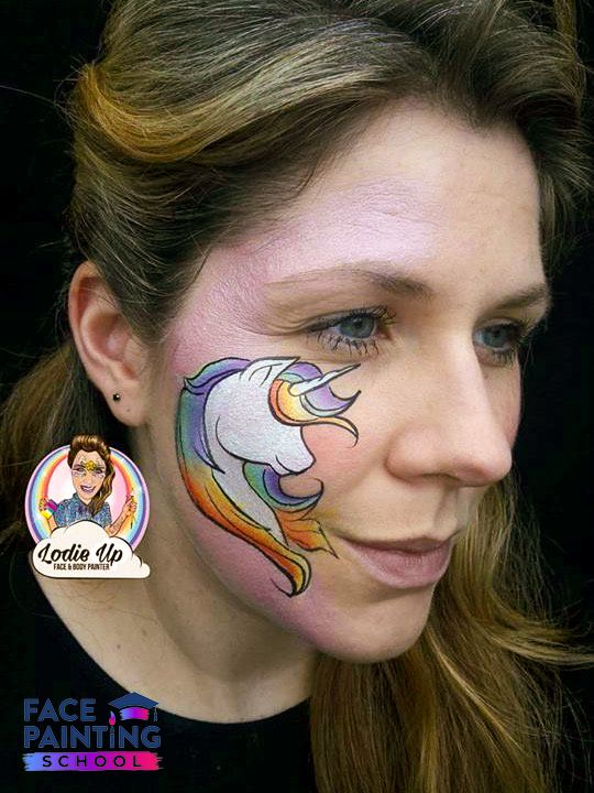 a woman with a base of a white unicorn face paint with rainbow mane now with a hard outline